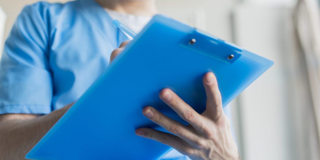 close-up-nurse-with-clipboard