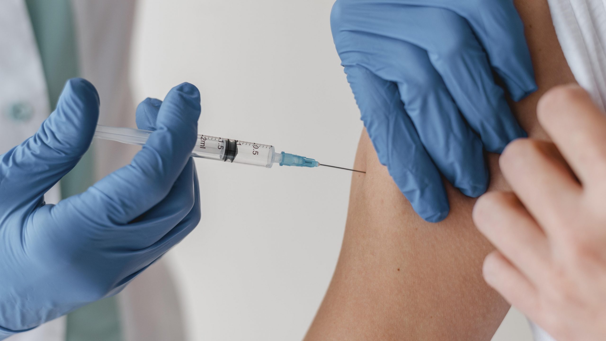 doctor-with-gloves-vaccinating-patient