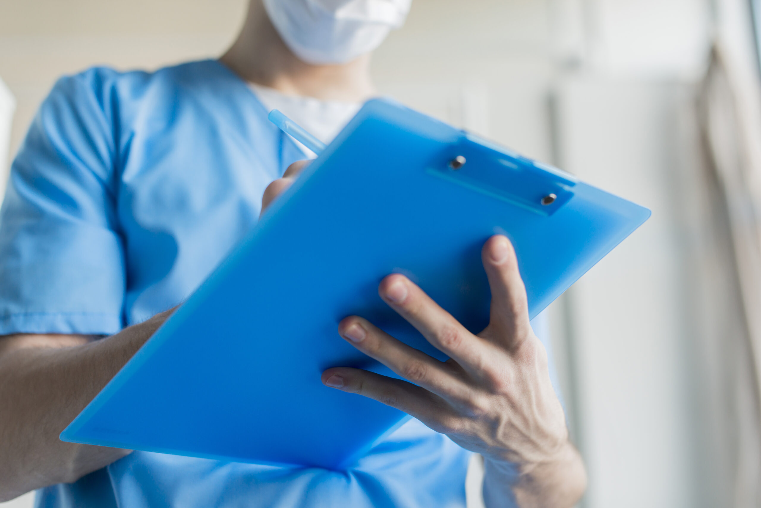 close-up-nurse-with-clipboard